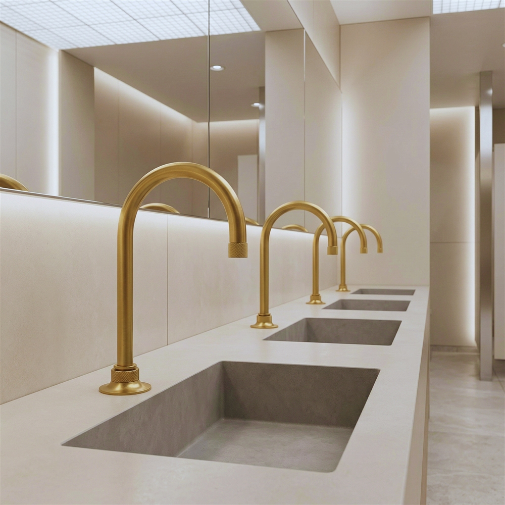 Modern public restroom with commercial faucets and white washbasins