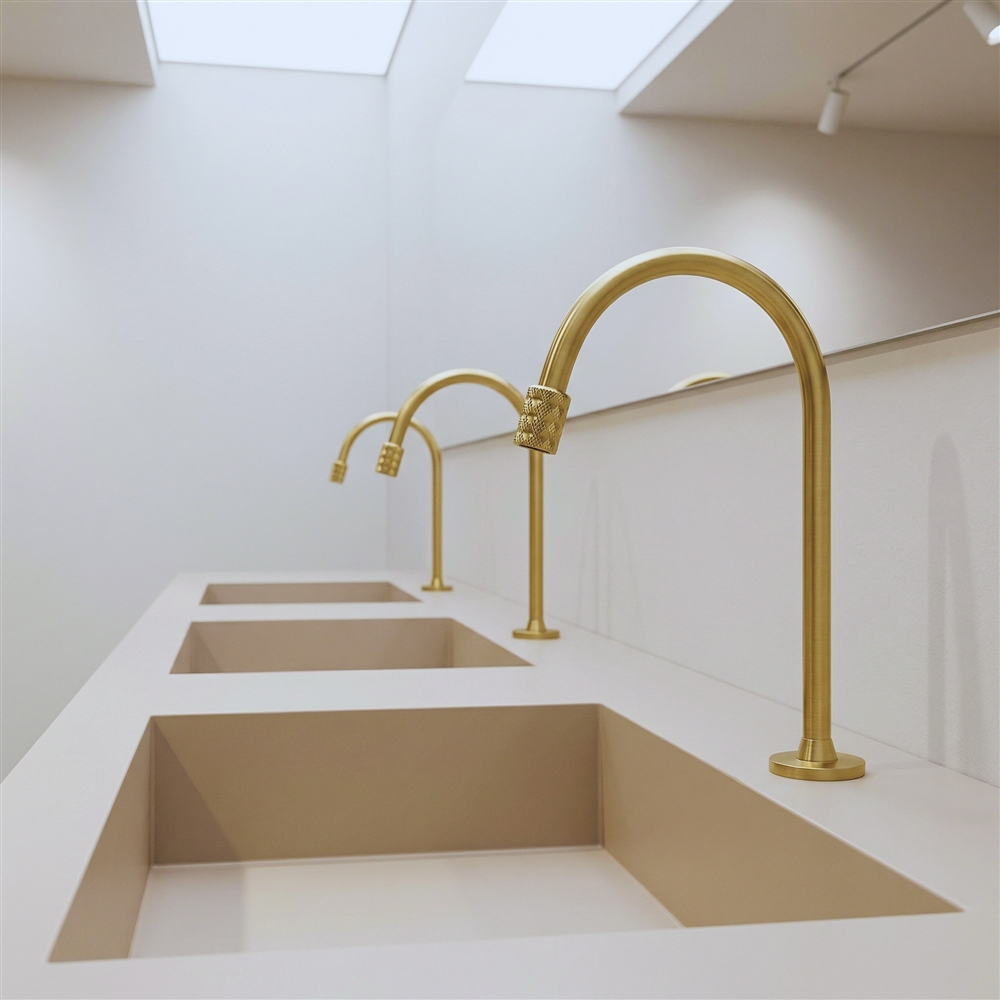 Public commercial restroom featuring electronic faucets and washbasins